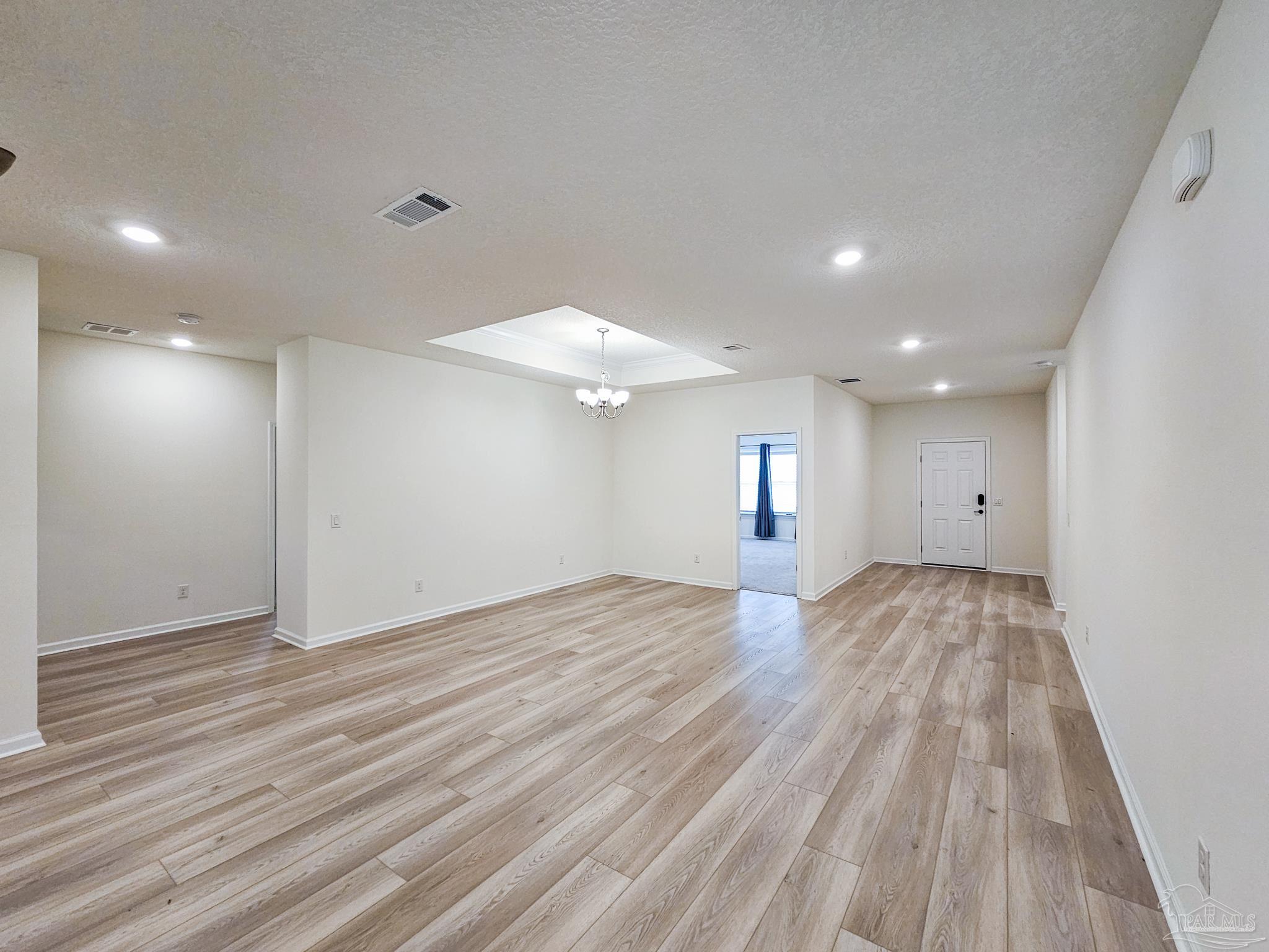 4149 Upper Walk Lane Milton, FL 32583 - Photo 10 of 43 a view of empty room with wooden floor
