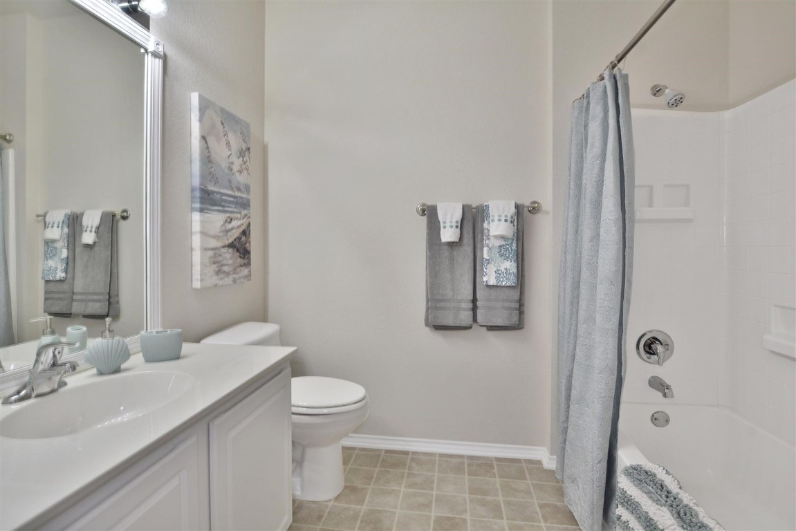 247 Bonham Loop Georgetown, TX 78633 - Photo 13 of 32 a bathroom with a sink a toilet and shower