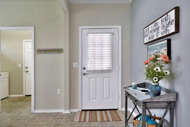 a view of an entryway with wooden floor