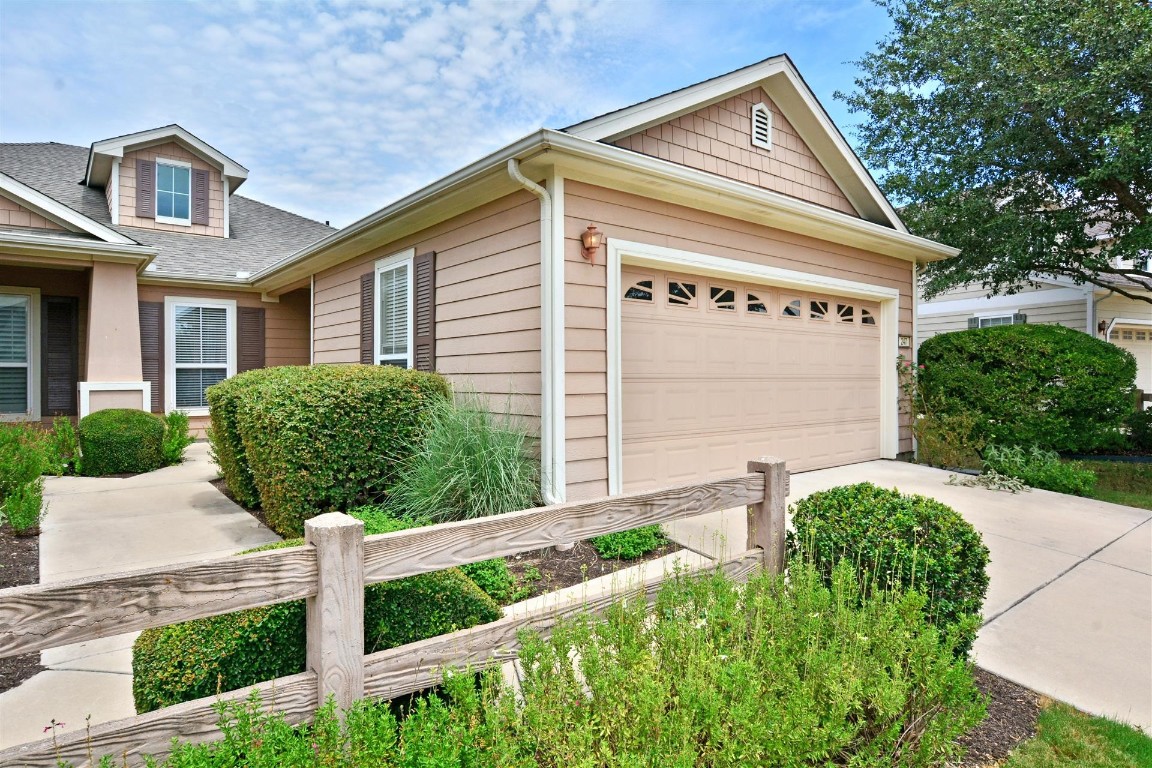 247 Bonham Loop Georgetown, TX 78633 - Photo 2 of 32 a front view of a house with garden