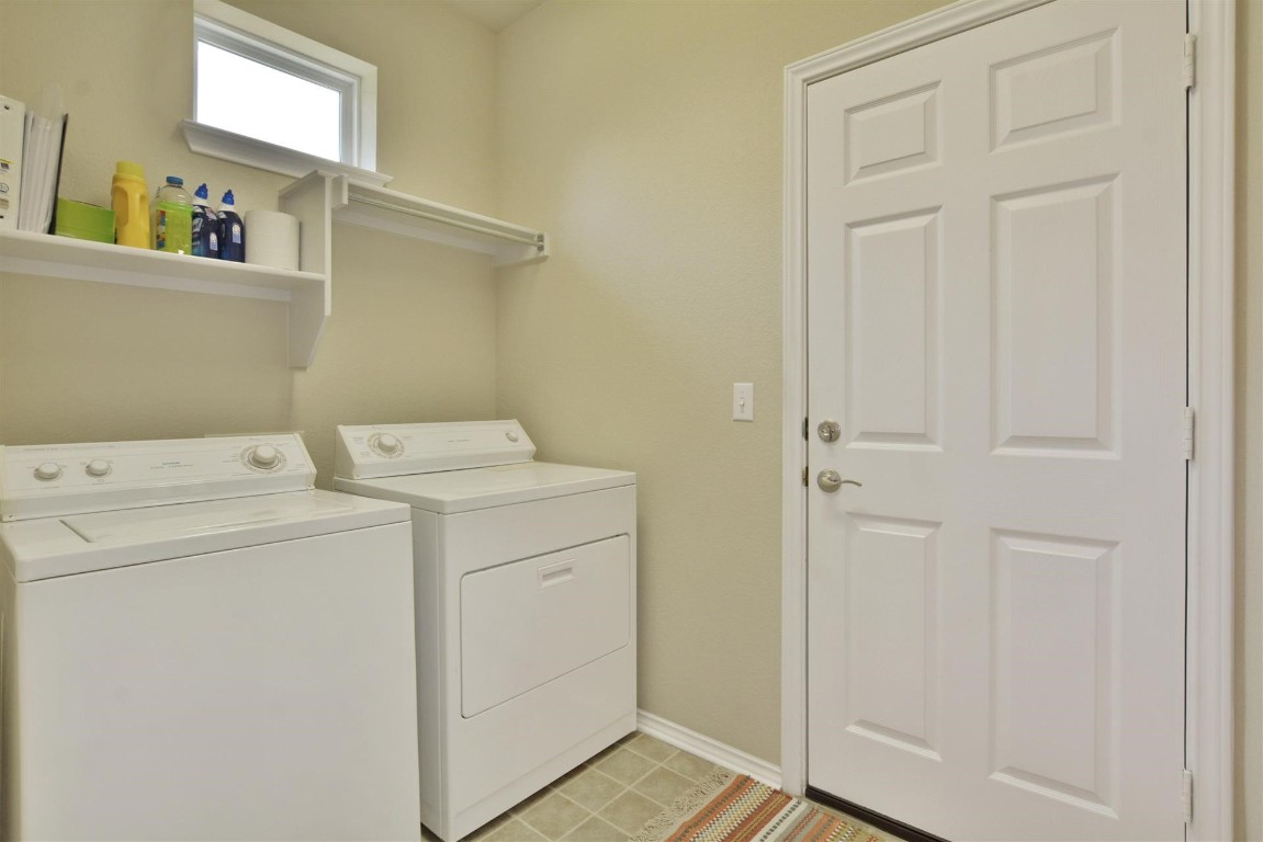 247 Bonham Loop Georgetown, TX 78633 - Photo 21 of 32 a utility room with dryer and washer