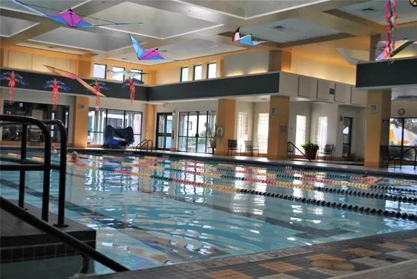 a view of hall way with dining room and furniture