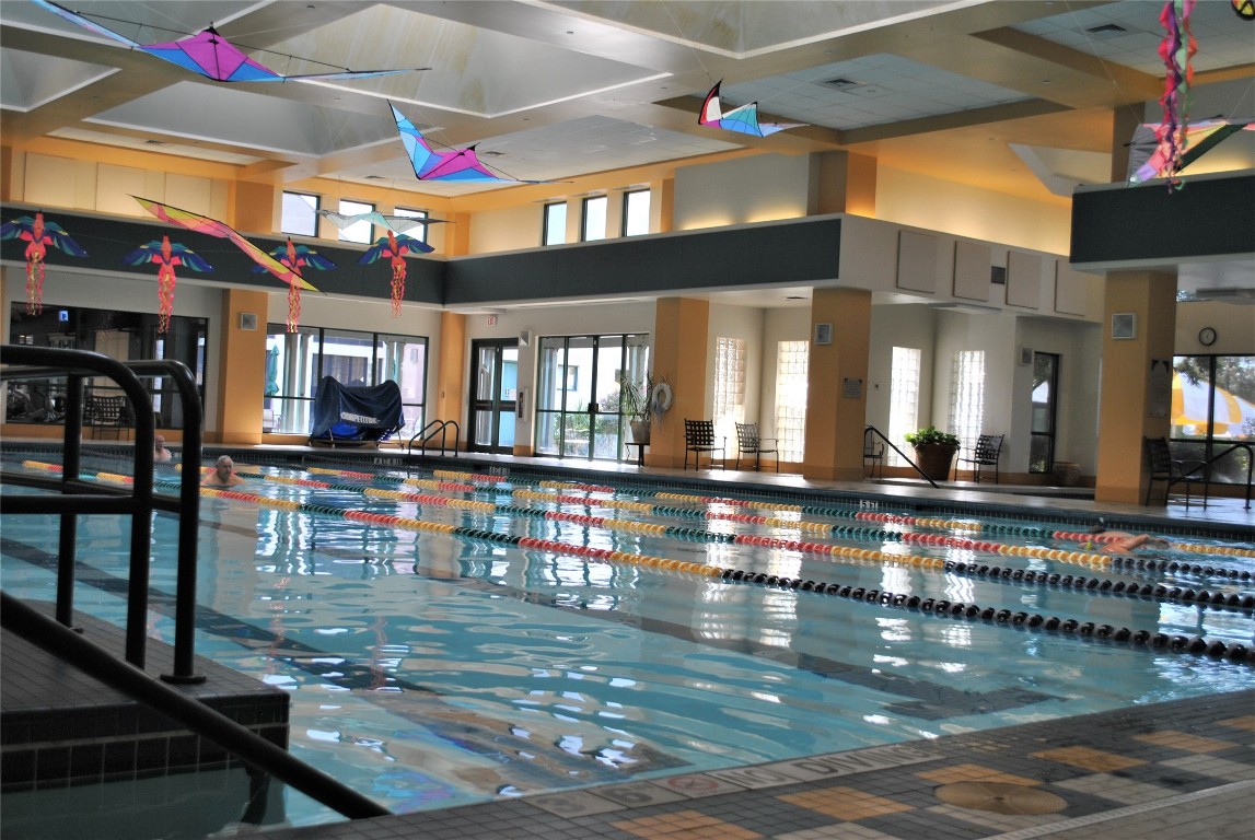 247 Bonham Loop Georgetown, TX 78633 - Photo 27 of 32 a view of hall way with dining room and furniture
