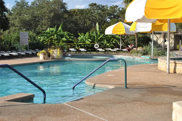 a view of swimming pool with outdoor seating