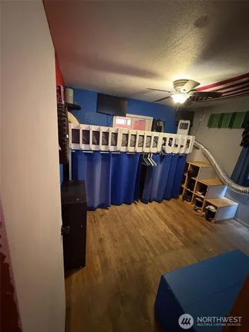 a bedroom with a bed and window