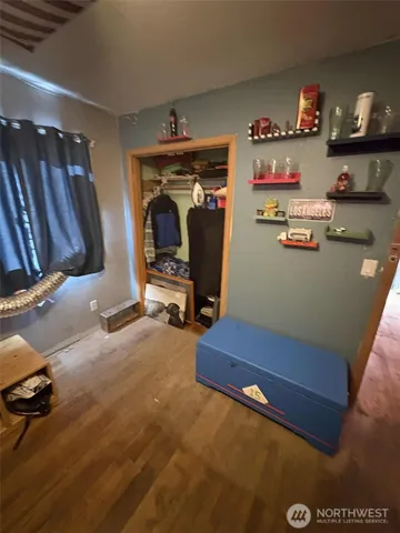 a bed room with a bed and a desk