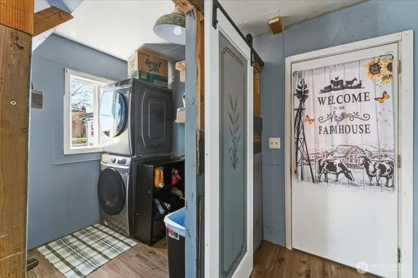 a view of a entryway door with a hallway