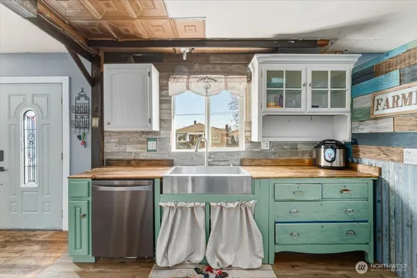 a kitchen with a sink and cabinets