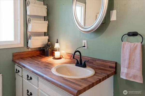 a bathroom with a sink and a mirror