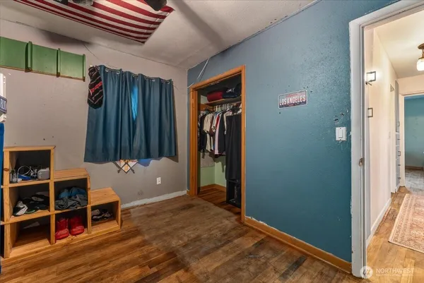 a very nice looking bedroom with a large window