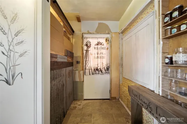 a view of entryway with a front door and wooden floor