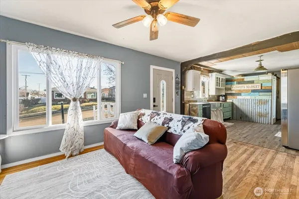 a living room with furniture and a large window