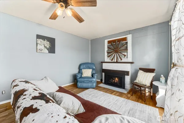 a bedroom with a bed and a fireplace