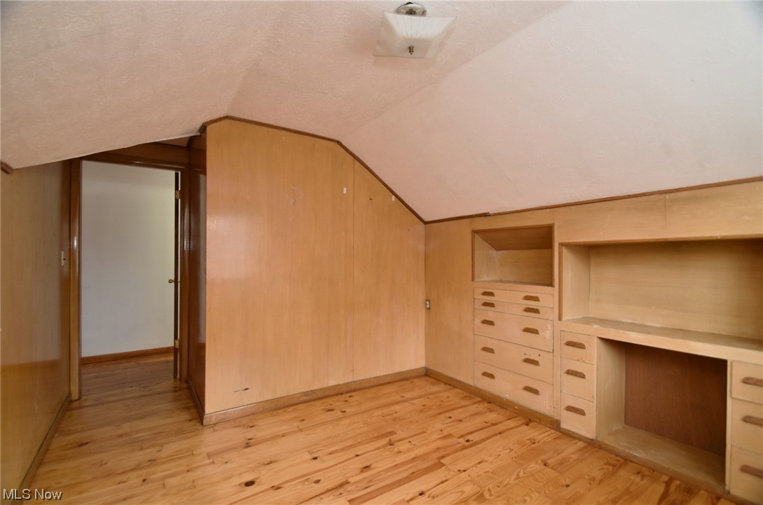 3681 Brinkmore Road Cleveland Heights, OH 44121 - Photo 24 of 27 Additional living space 8with built in features, light wood-type flooring, and vaulted ceiling