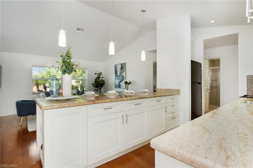 1534 Northgate Drive Naples, FL 34105 - Photo 12 of 50 a bathroom with a sink and a mirror