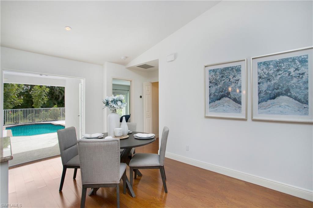 1534 Northgate Drive Naples, FL 34105 - Photo 14 of 50 a dining room with furniture and a floor to ceiling window