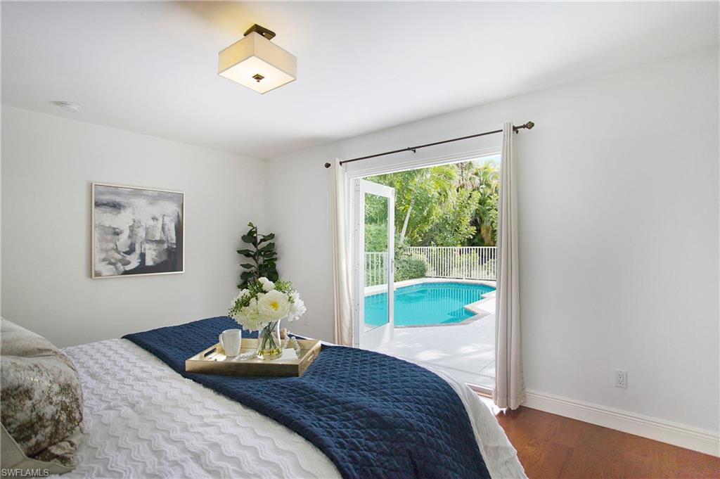 1534 Northgate Drive Naples, FL 34105 - Photo 20 of 50 a bedroom with a bed and a window