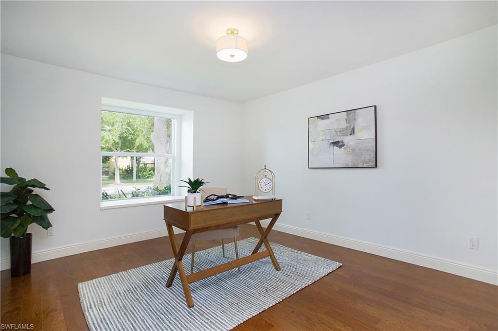 1534 Northgate Drive Naples, FL 34105 - Photo 24 of 50 a living room with furniture and a window