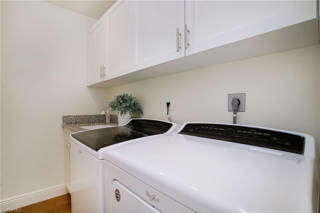 1534 Northgate Drive Naples, FL 34105 - Photo 29 of 50 a kitchen with a sink and cabinets