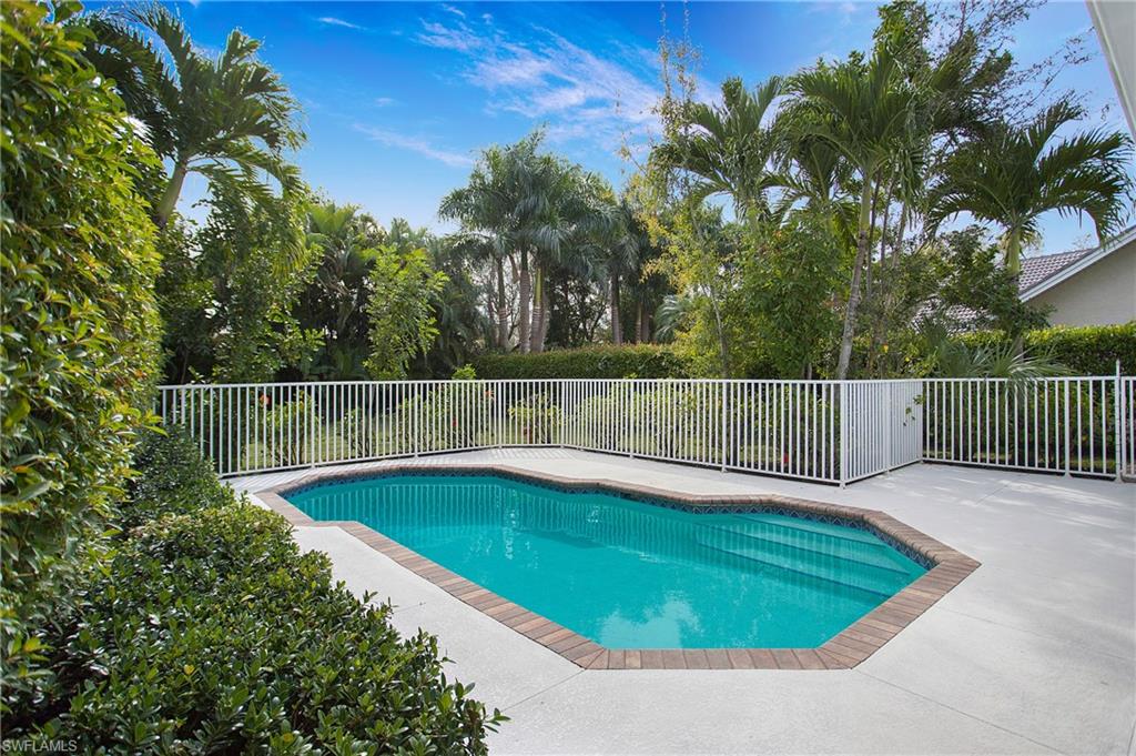 1534 Northgate Drive Naples, FL 34105 - Photo 32 of 50 a view of a backyard with a small pool