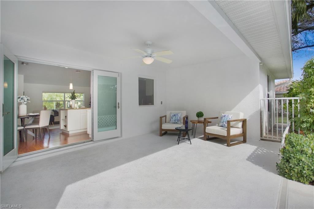 1534 Northgate Drive Naples, FL 34105 - Photo 34 of 50 a living room with furniture and a table