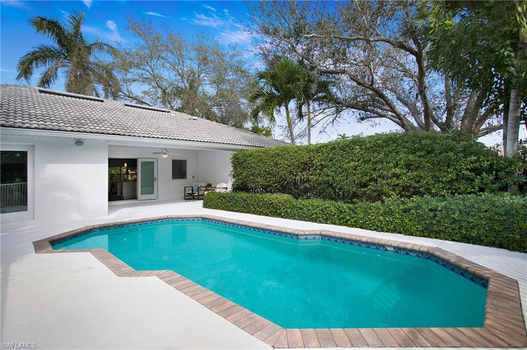 1534 Northgate Drive Naples, FL 34105 - Photo 37 of 50 a view of a house with a swimming pool