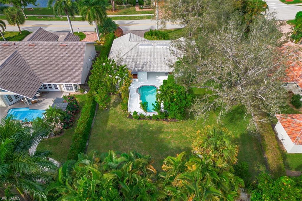 1534 Northgate Drive Naples, FL 34105 - Photo 43 of 50 a view of a garden with swimming pool