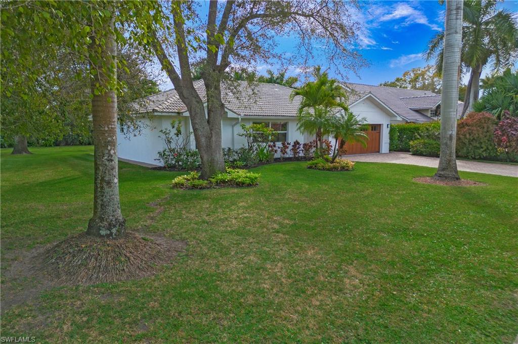 1534 Northgate Drive Naples, FL 34105 - Photo 49 of 50 a view of a house with a back yard