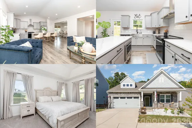 a living room with stainless steel appliances furniture a rug and a kitchen