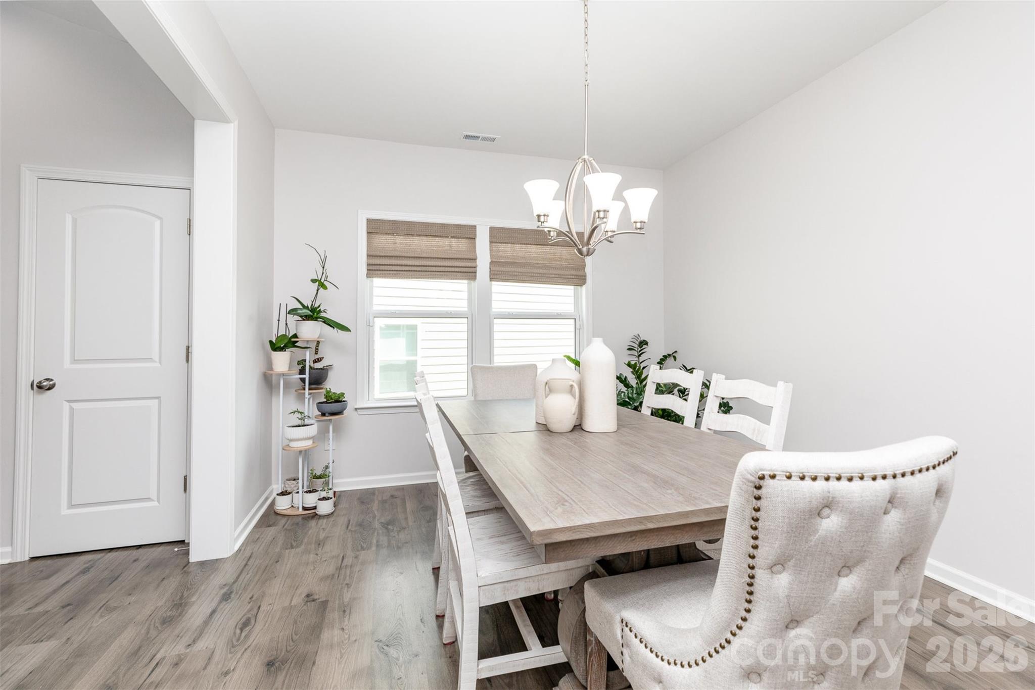 948 Scotch Meadows Loop Monroe, NC 28110 - Photo 16 of 25 a view of a dining room with furniture window and wooden floor