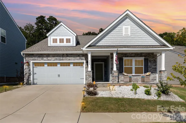 a front view of a house with yard