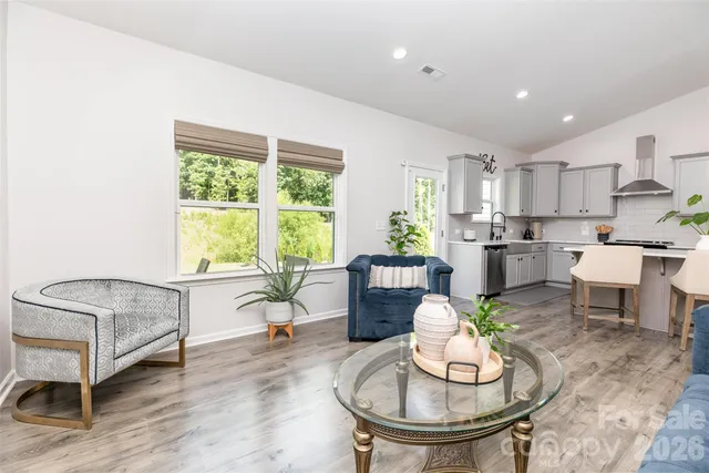 a living room with furniture and a table