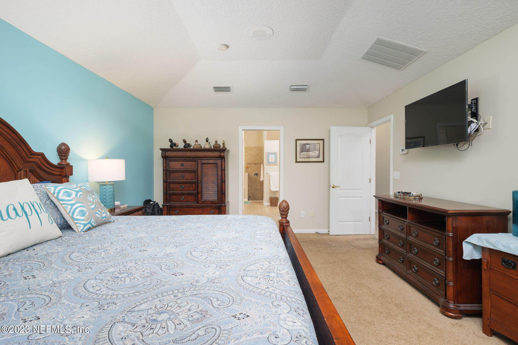 1075 Green Pine Circle Orange Park, FL 32065 - Photo 15 of 35 a bedroom with furniture and a flat screen tv