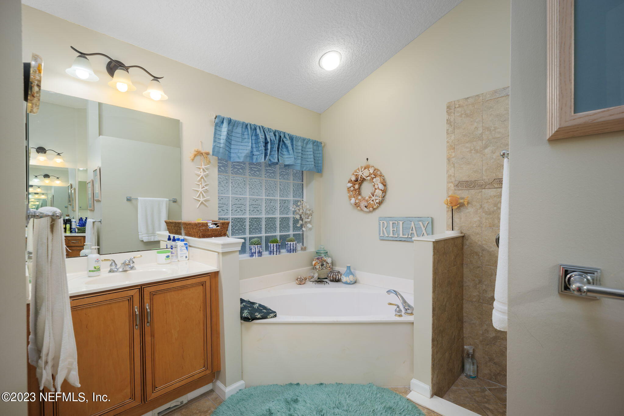 1075 Green Pine Circle Orange Park, FL 32065 - Photo 17 of 35 a bathroom with a sink a vanity and a mirror