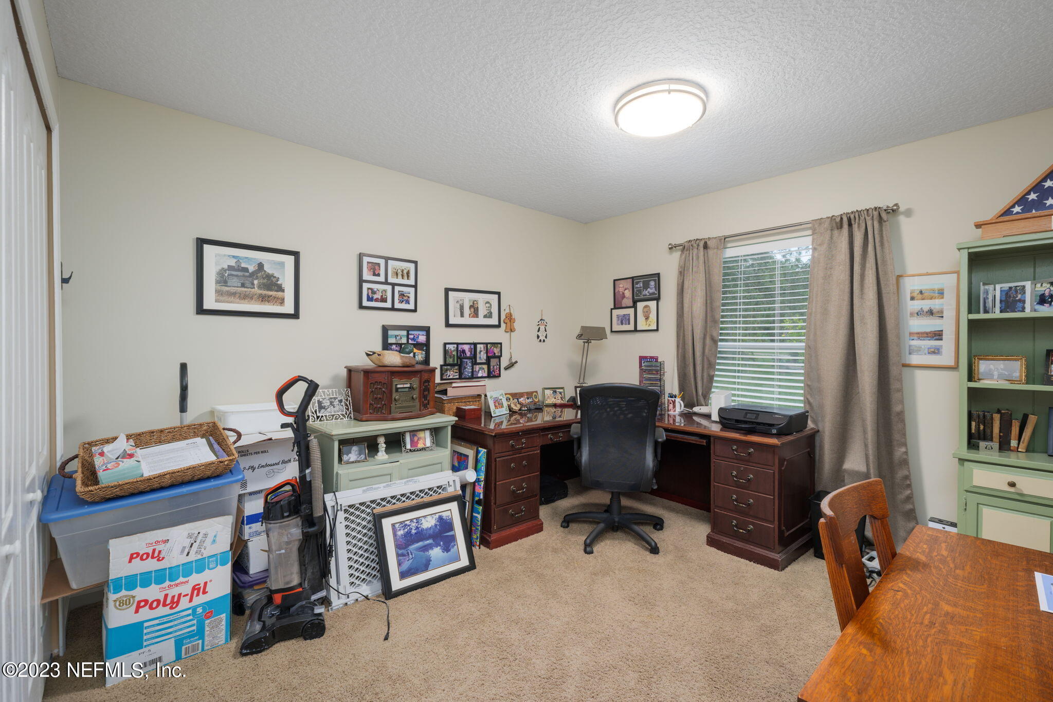 1075 Green Pine Circle Orange Park, FL 32065 - Photo 19 of 35 a view of a workspace with lounge chair and a window