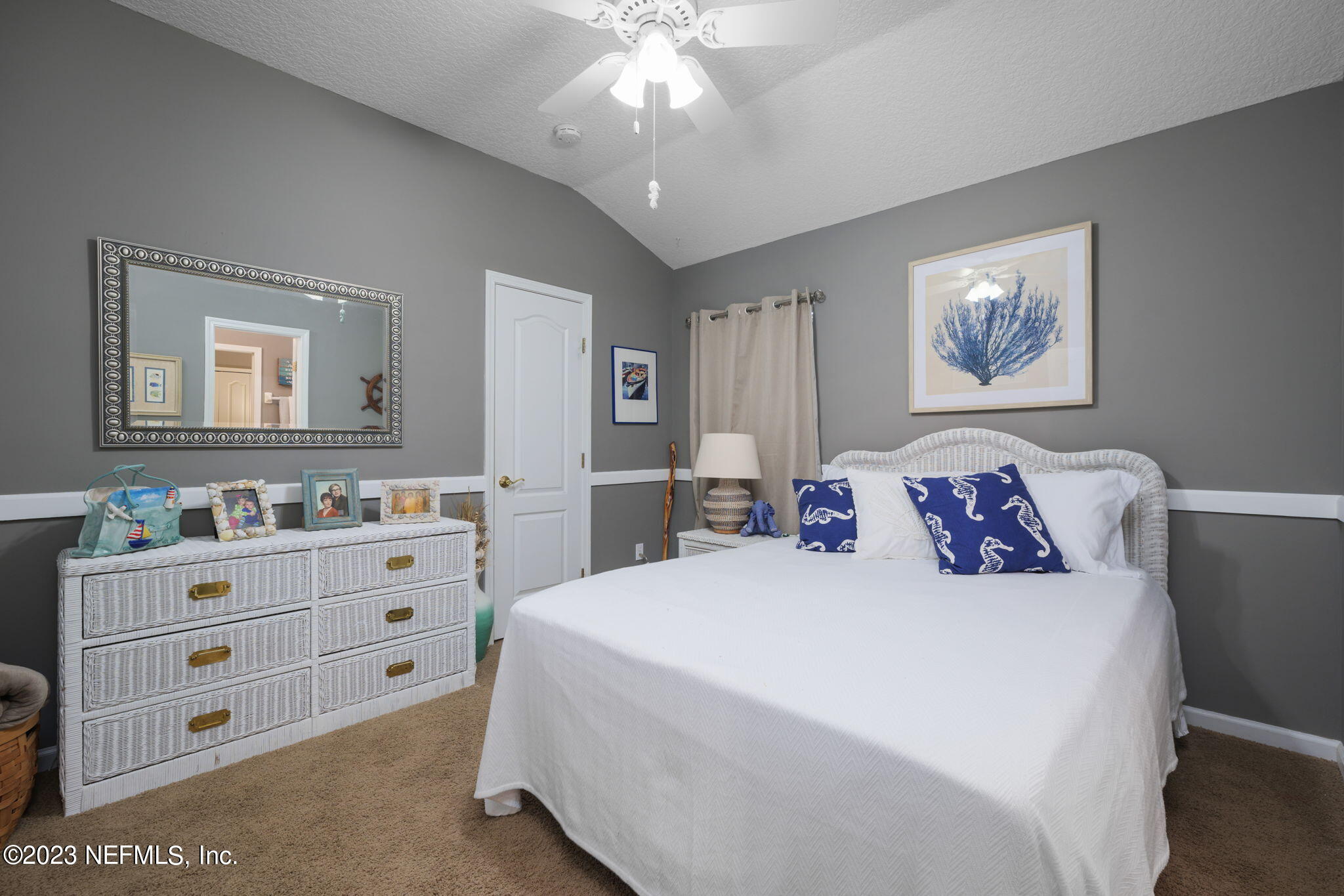 1075 Green Pine Circle Orange Park, FL 32065 - Photo 22 of 35 a spacious bedroom with a bed and a chandelier