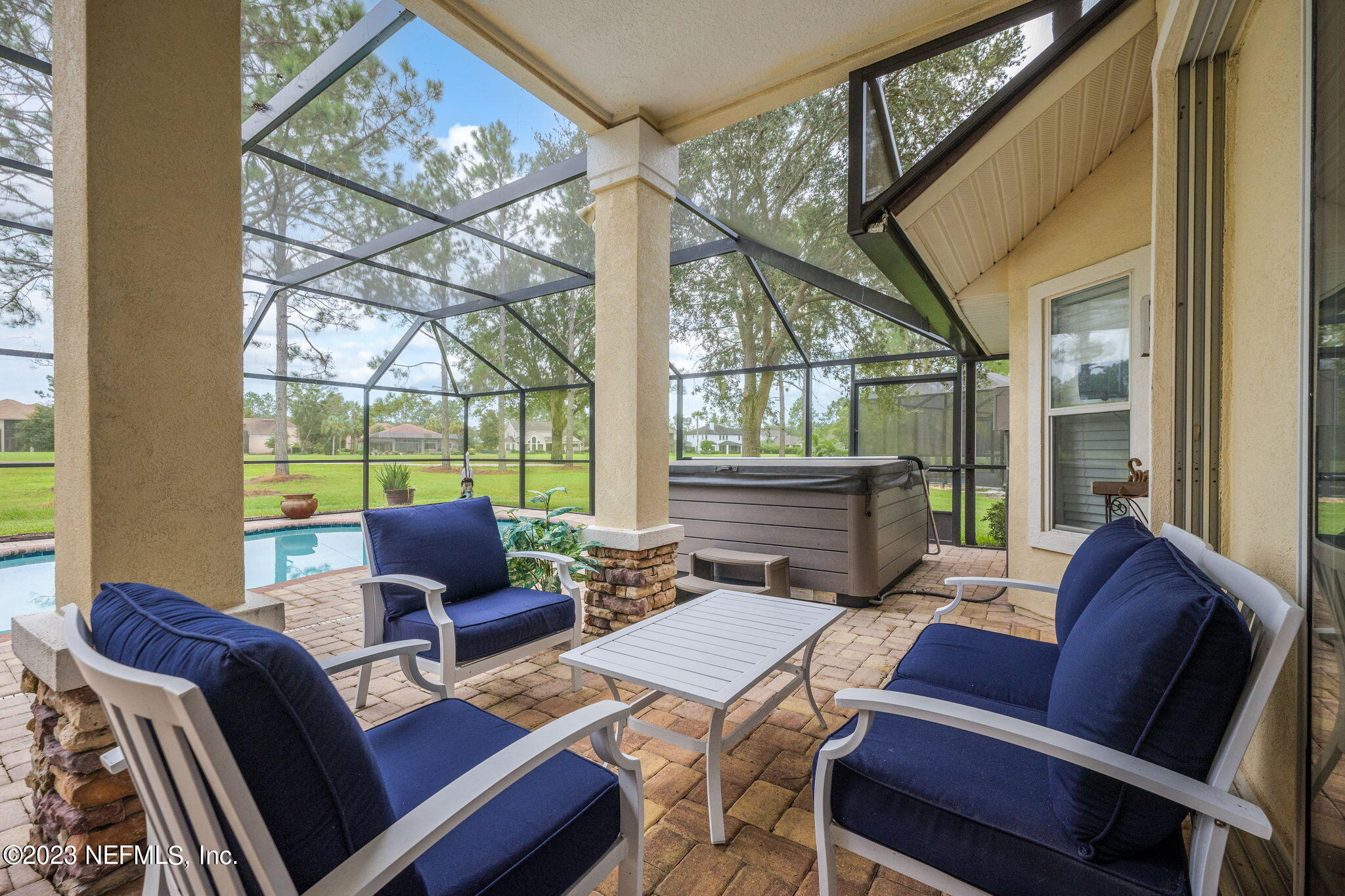 1075 Green Pine Circle Orange Park, FL 32065 - Photo 27 of 35 a view of a dining room with furniture a chandelier and wooden floor