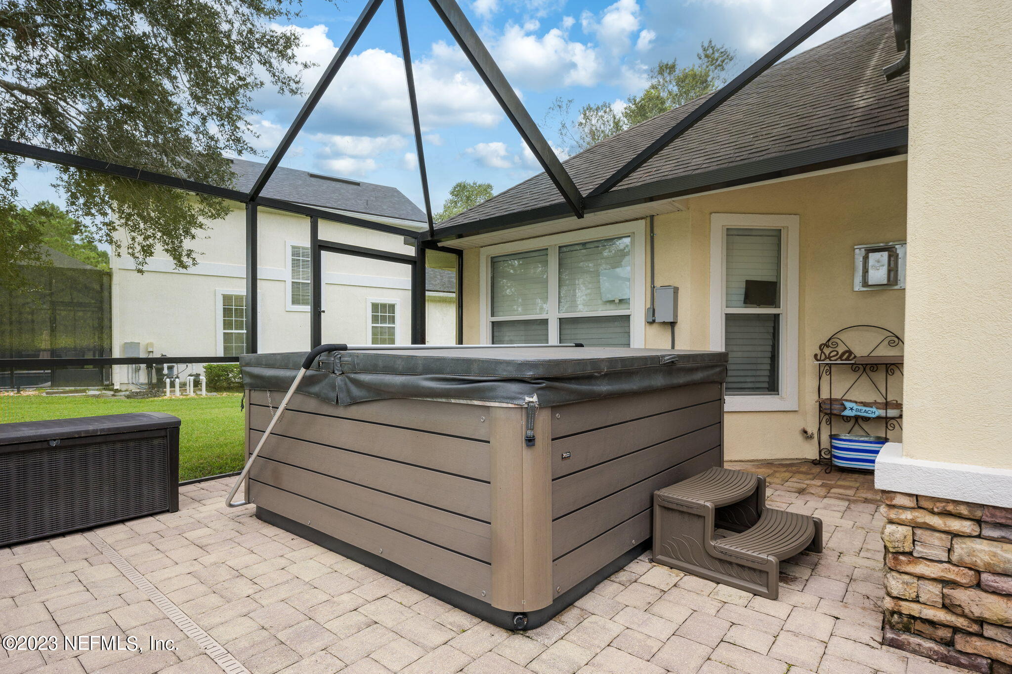 1075 Green Pine Circle Orange Park, FL 32065 - Photo 28 of 35 a view of living room kitchen with stainless steel appliances granite countertop couches and table in the patio