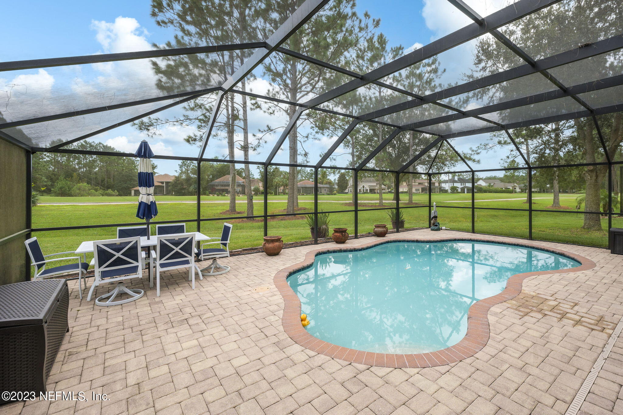 1075 Green Pine Circle Orange Park, FL 32065 - Photo 29 of 35 a view of a swimming pool with a patio