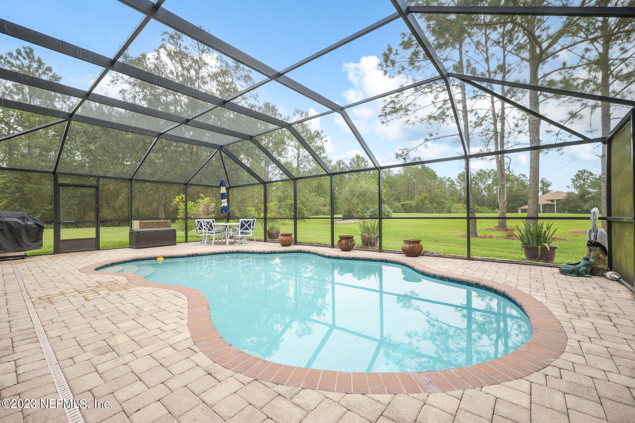 1075 Green Pine Circle Orange Park, FL 32065 - Photo 30 of 35 a view of a swimming pool with a patio