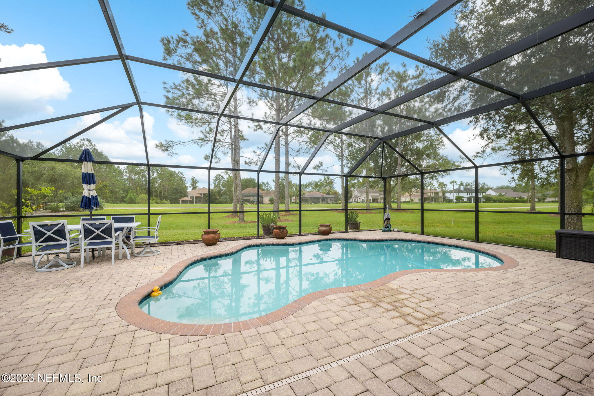 1075 Green Pine Circle Orange Park, FL 32065 - Photo 31 of 35 a view of a swimming pool with a patio