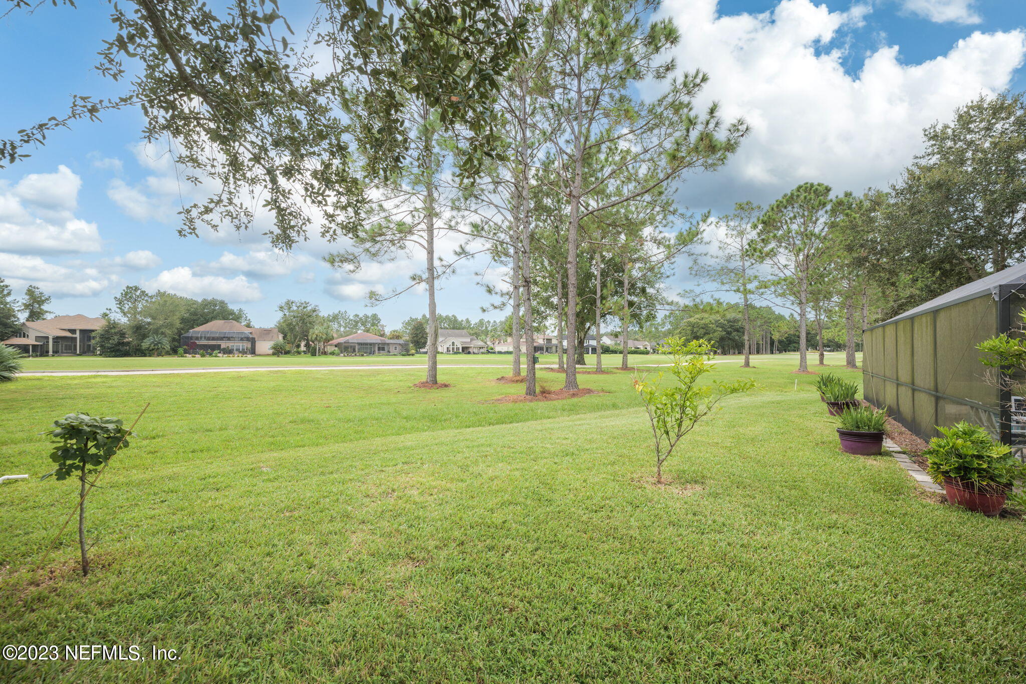 1075 Green Pine Circle Orange Park, FL 32065 - Photo 34 of 35 a view of a park with swings and slides