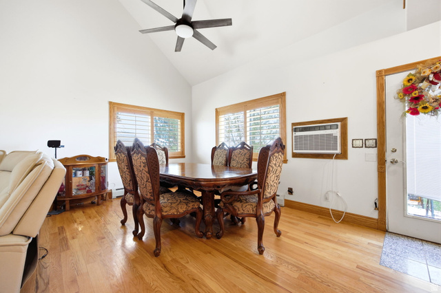 169 Taylor Road, Unit 101 Grantsville, UT 84029 - Photo 13 of 47 Main home - Vaulted ceilings highlight this space featuring wood-finish flooring and natural wood window trim