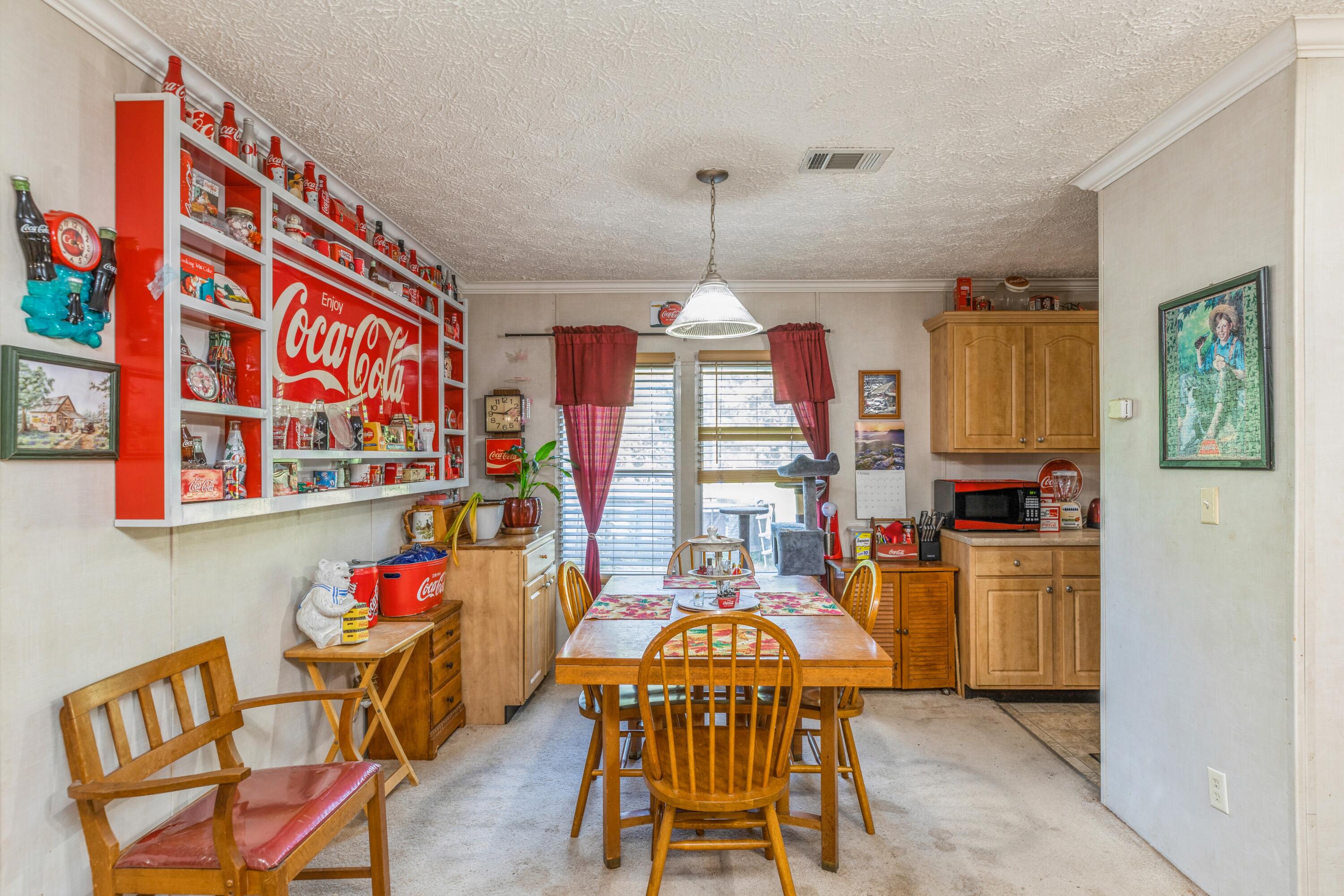 8495 Creston Barrow Road Baker, FL 32531 - Photo 15 of 35 a view of a dining room with furniture window and outside view