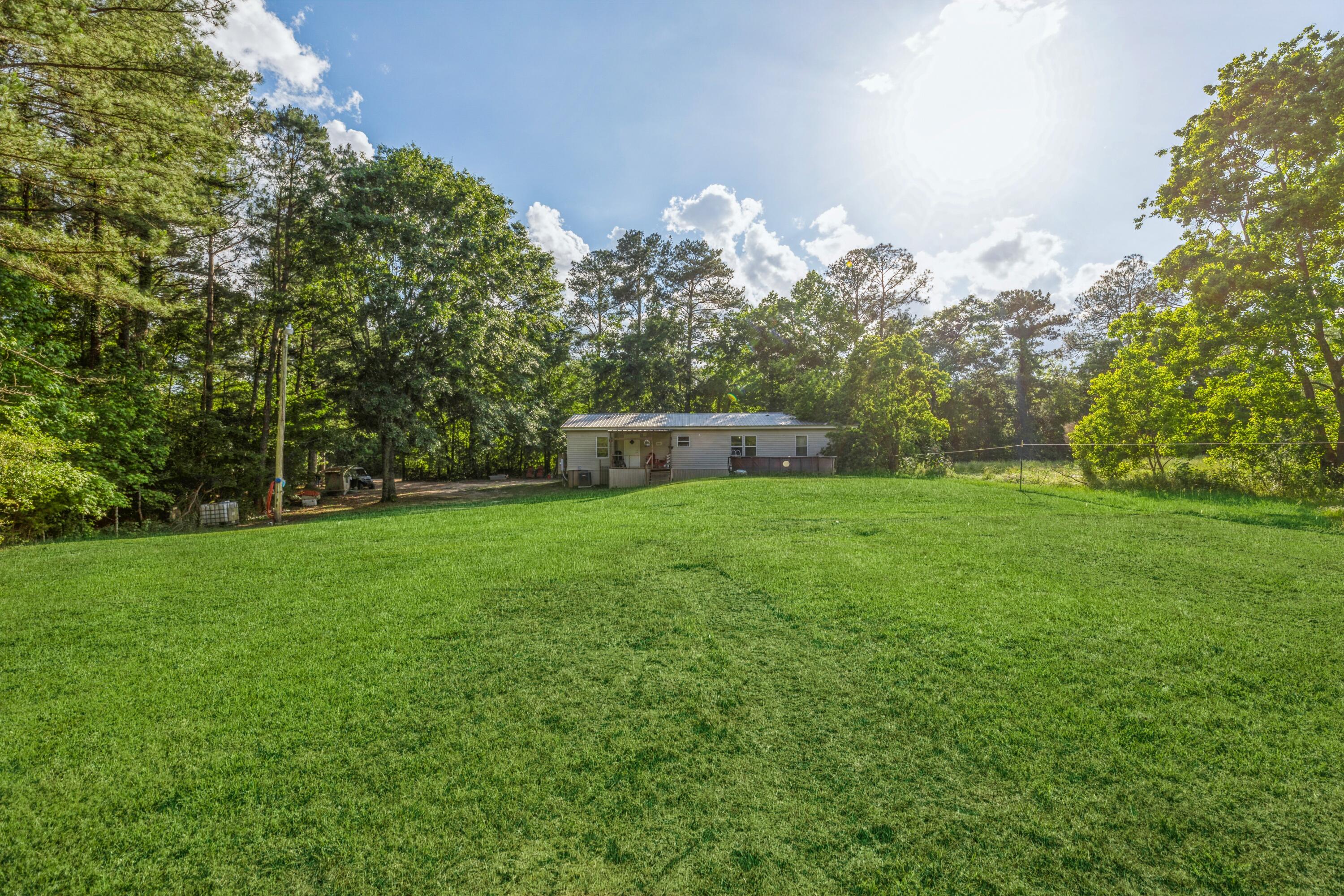8495 Creston Barrow Road Baker, FL 32531 - Photo 32 of 35 a view of a house with a yard