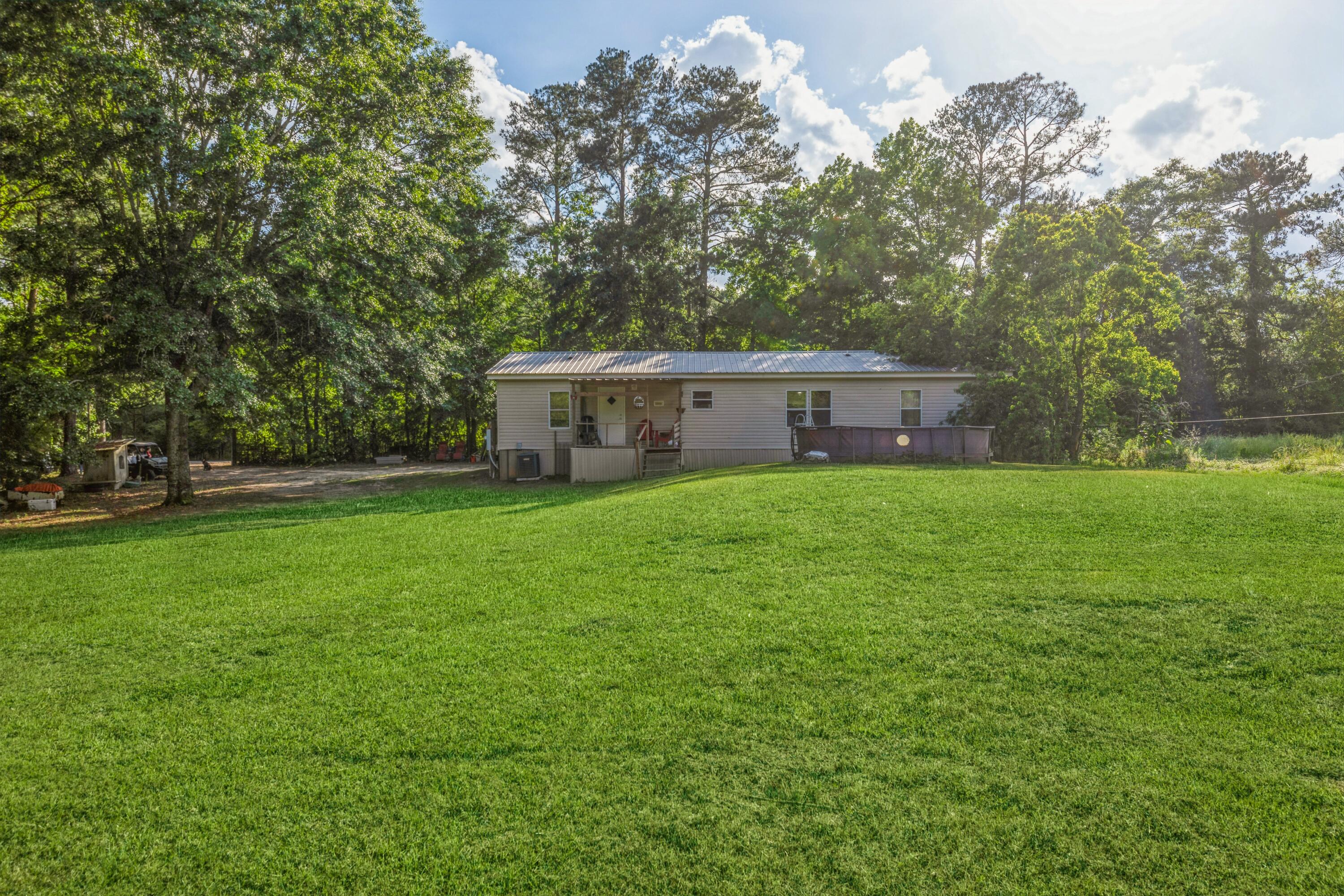 8495 Creston Barrow Road Baker, FL 32531 - Photo 33 of 35 a view of a house with a big yard
