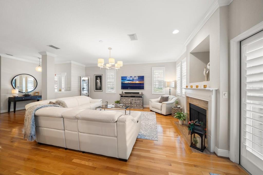 291 1st Avenue Southwest Largo, FL 33770 - Photo 17 of 83 a bedroom with a large bed and a fireplace