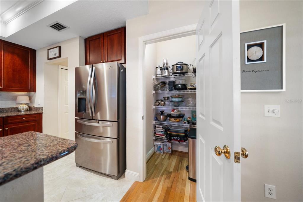 291 1st Avenue Southwest Largo, FL 33770 - Photo 31 of 83 a kitchen with stainless steel appliances granite countertop a refrigerator and a stove