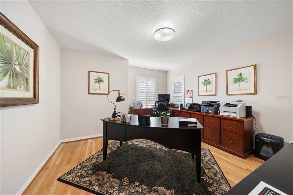 291 1st Avenue Southwest Largo, FL 33770 - Photo 37 of 83 a work room with furniture a rug and a window