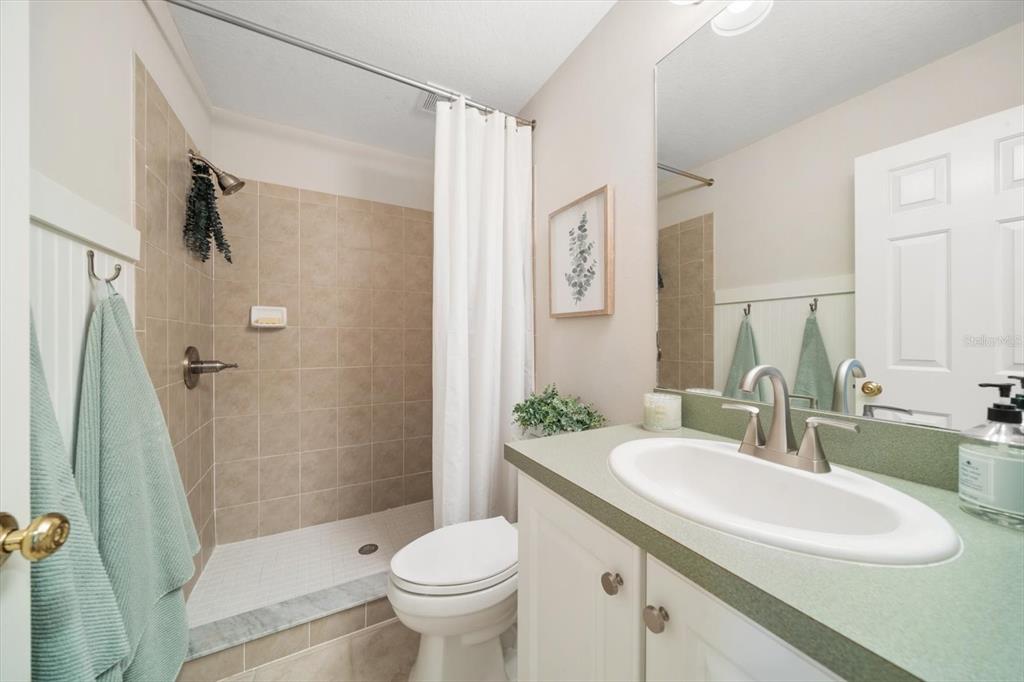 291 1st Avenue Southwest Largo, FL 33770 - Photo 38 of 83 a bathroom with a sink toilet and shower